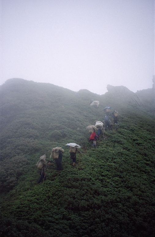 97 C 2 142 1997 Porters Hiking up Misty Ridge